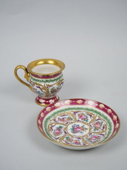 LIMOGES
Porcelain cup and saucer with polychrome...