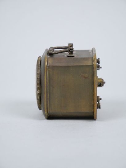 Small travel clock with white enameled dial...