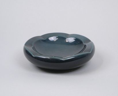 Blue earthenware ashtray with wavy edges.
Dimensions:...