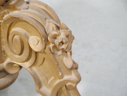 Gilded wood pedestal table carved with scrolls...