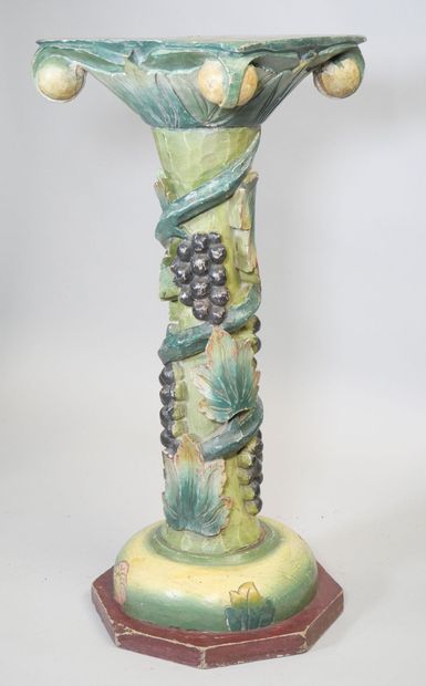Wooden torso column with polychrome vine...