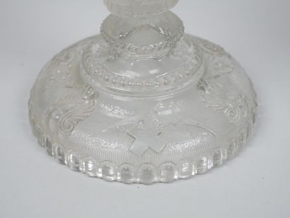 A pair of candlesticks in partially frosted...