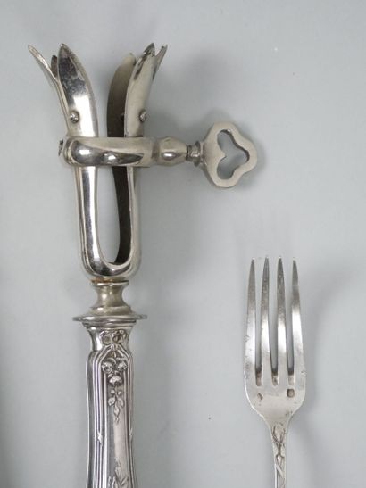 Silver flatware with ribbon and laurel leaf...