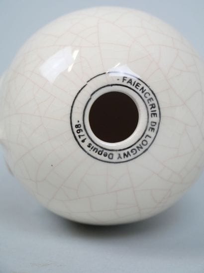 LONGWY
Pair of cracked earthenware eggs decorated...