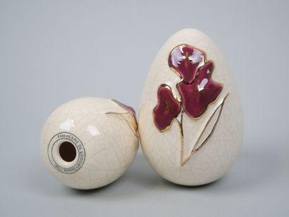 LONGWY
Pair of cracked earthenware eggs decorated...