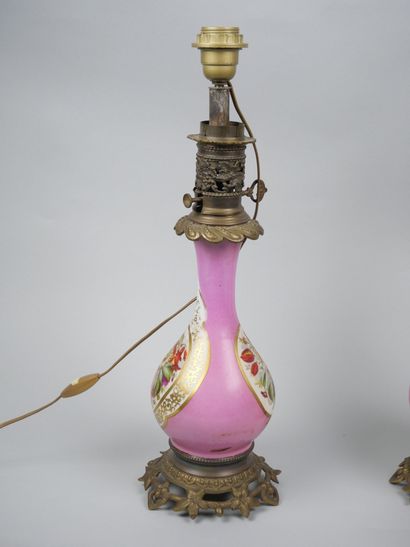 Pair of porcelain oil lamps with polychrome...