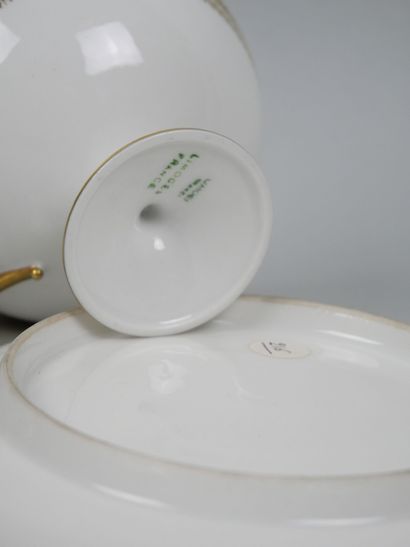 LIMOGES 
Set of three porcelain cups on pedestal...
