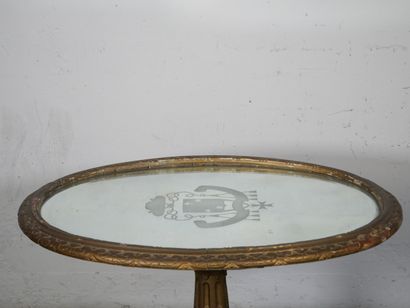 Gilded wood pedestal table carved with scrolls...