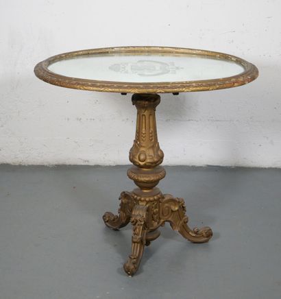 Gilded wood pedestal table carved with scrolls...