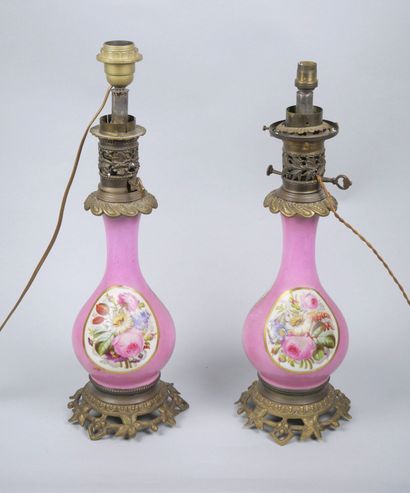 Pair of porcelain oil lamps with polychrome...