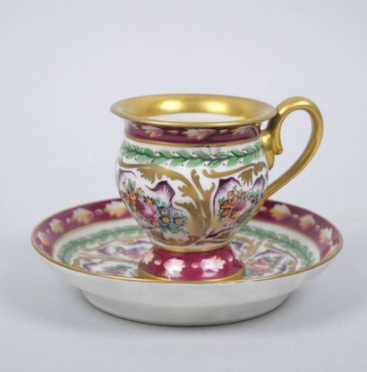 LIMOGES
Porcelain cup and saucer with polychrome...