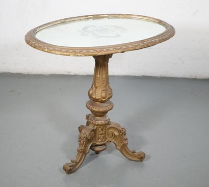 Gilded wood pedestal table carved with scrolls...