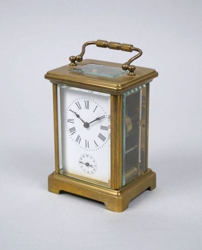 Officer's travel alarm clock with brass cage...