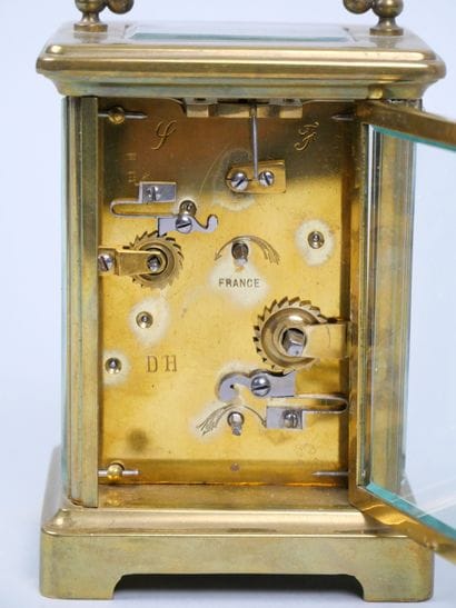Officer's travel alarm clock with brass cage...