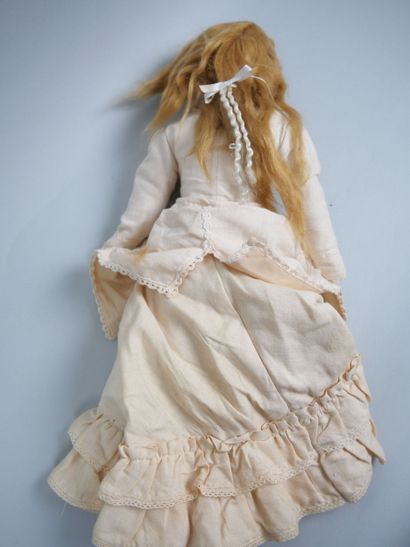 Porcelain head doll, fixed blue eyes, closed...