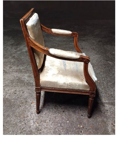 Moulded and carved natural wood armchair...
