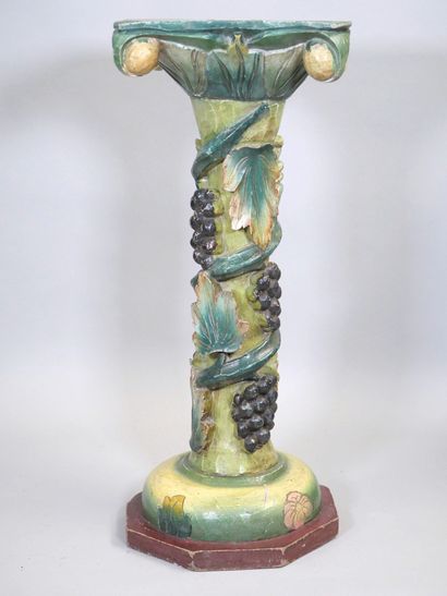 Wooden torso column with polychrome vine...