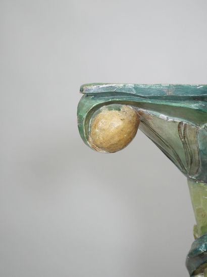 Wooden torso column with polychrome vine...