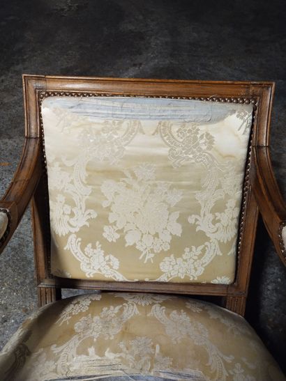 Moulded and carved natural wood armchair...