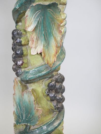 Wooden torso column with polychrome vine...