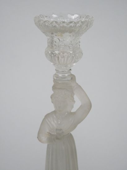 A pair of candlesticks in partially frosted...