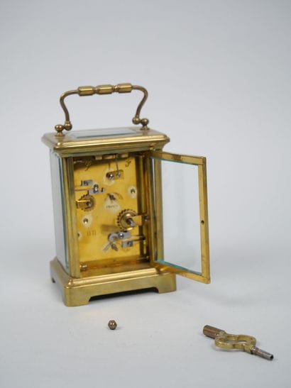 Officer's travel alarm clock with brass cage...