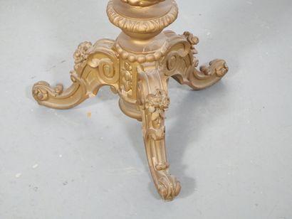 Gilded wood pedestal table carved with scrolls...