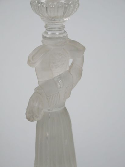 A pair of candlesticks in partially frosted...