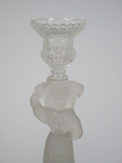 A pair of candlesticks in partially frosted...