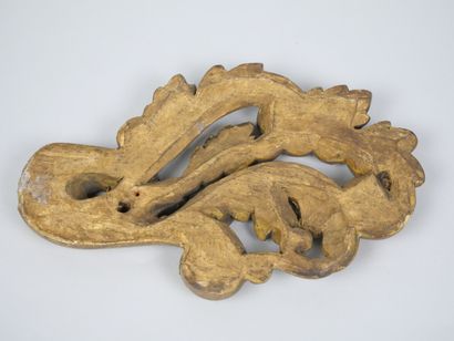 Reunion of two carved and gilded wood elements,...
