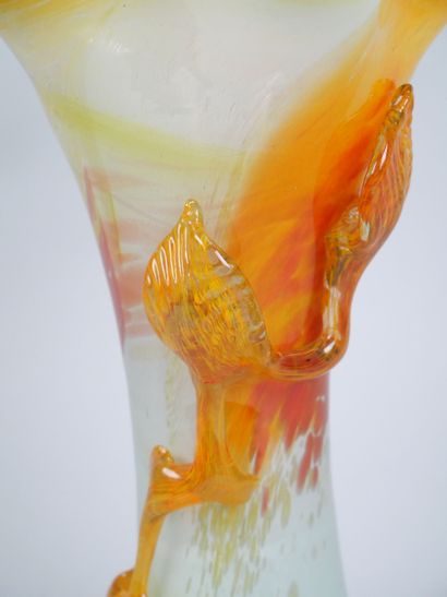 Orange-toned blown glass corolla vase decorated...