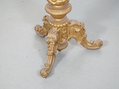 Gilded wood pedestal table carved with scrolls...