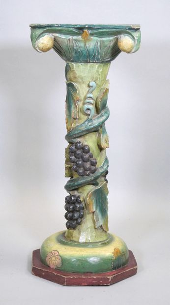 Wooden torso column with polychrome vine...