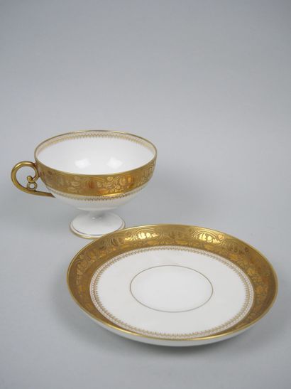 LIMOGES 
Set of three porcelain cups on pedestal...