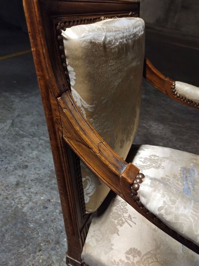 Moulded and carved natural wood armchair...