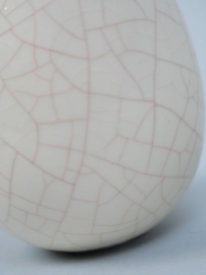 LONGWY
Pair of cracked earthenware eggs decorated...