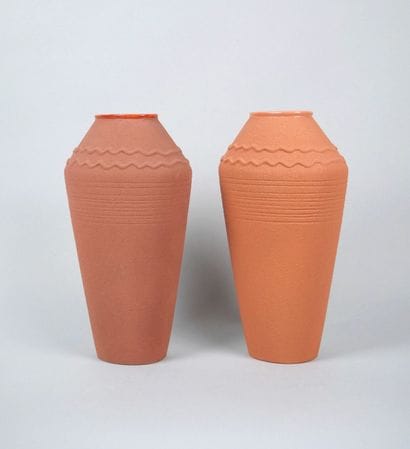 Reunion of two terra cota earthenware vases...