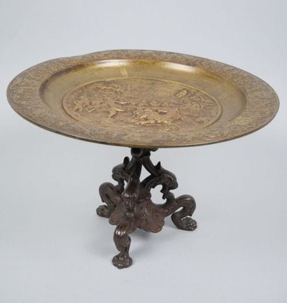 Bronze tripod bowl with relief decoration...