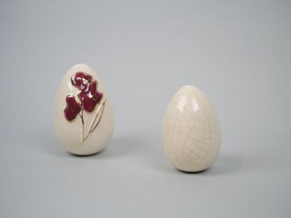 LONGWY
Pair of cracked earthenware eggs decorated...