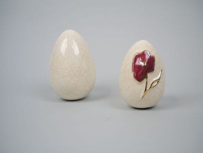 LONGWY
Pair of cracked earthenware eggs decorated...
