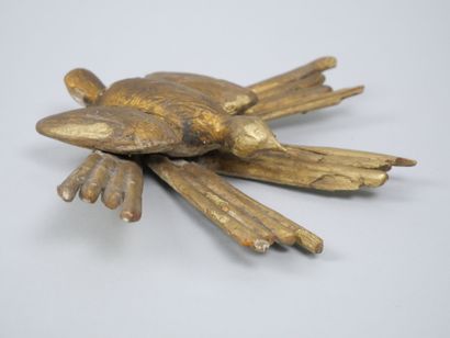 Reunion of two carved and gilded wood elements,...
