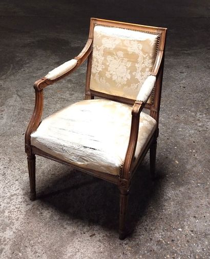 Moulded and carved natural wood armchair...