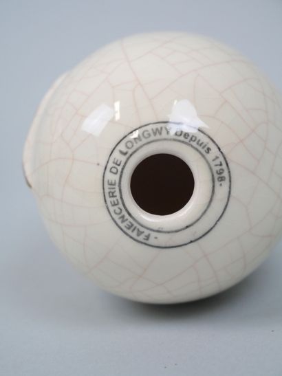 LONGWY
Pair of cracked earthenware eggs decorated...