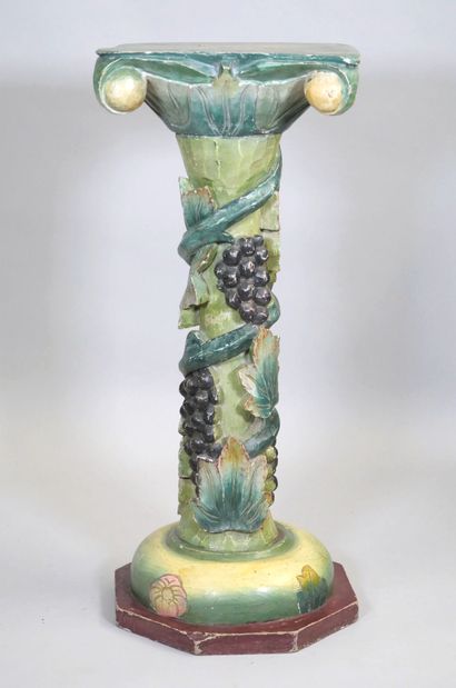 Wooden torso column with polychrome vine...