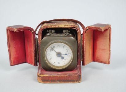 Small travel clock with white enameled dial...