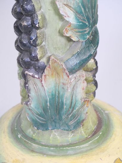 Wooden torso column with polychrome vine...