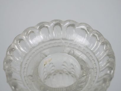 A pair of candlesticks in partially frosted...