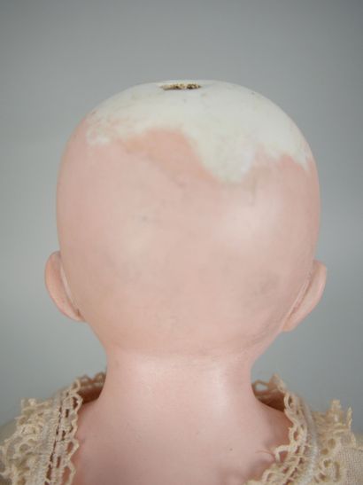 Porcelain head doll, fixed blue eyes, closed...