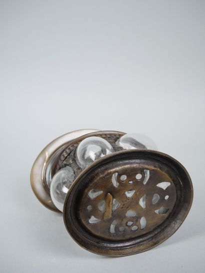 Oval blown-glass and metal cookie tin decorated...