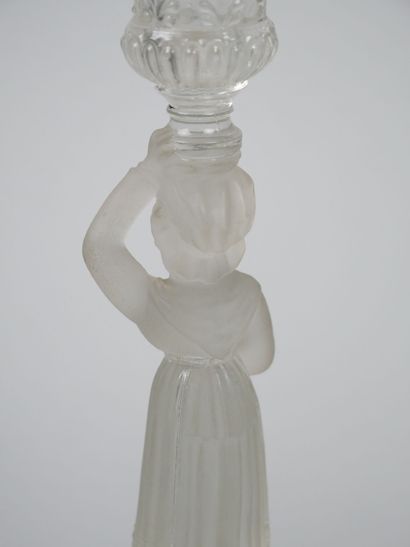 A pair of candlesticks in partially frosted...